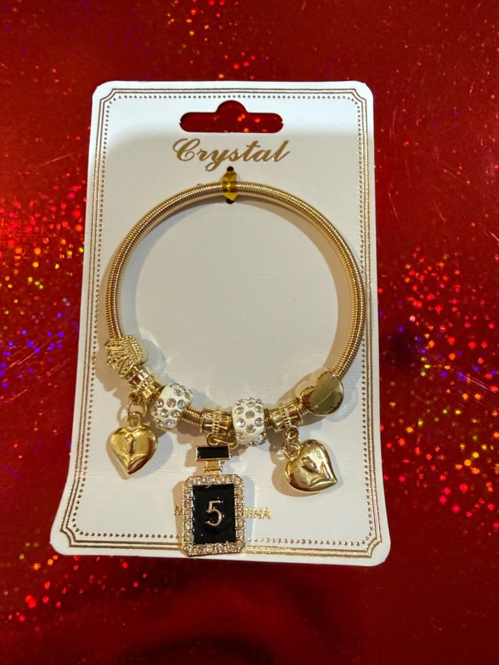 Gold-Tone Charm Bracelet with Black Perfume Bottle Charm